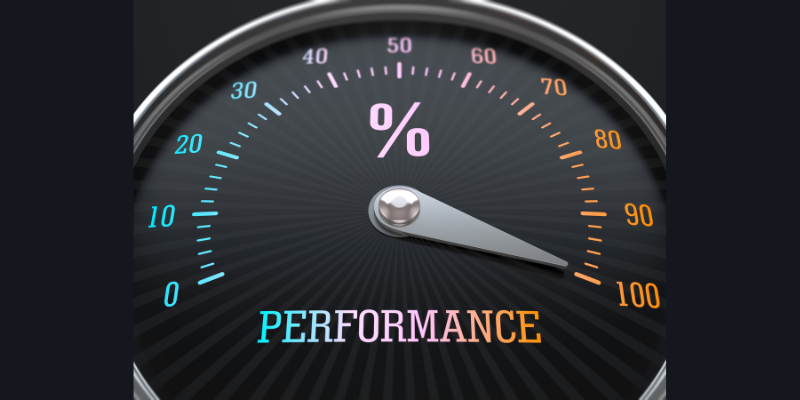 A speedometer with the word performance.